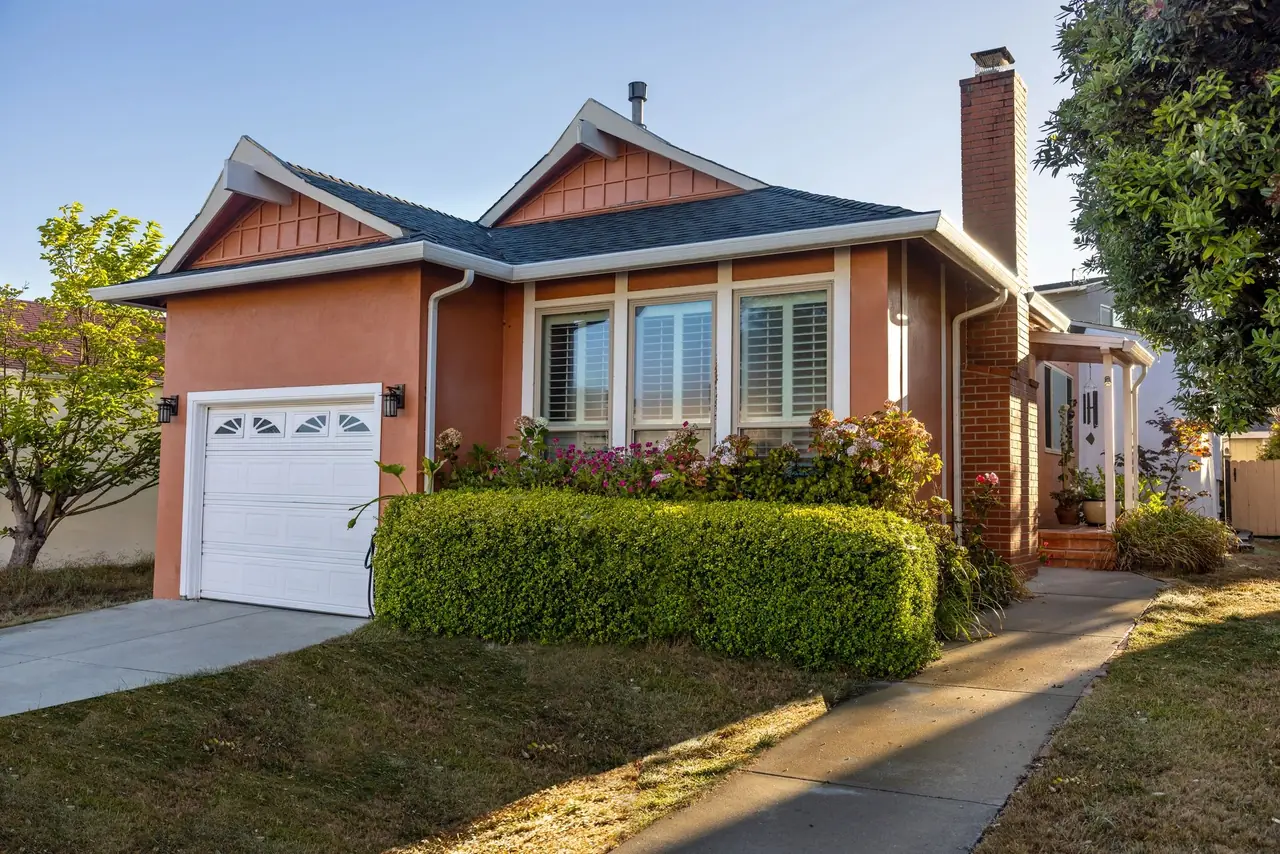 Home exterior with landscaped front garden